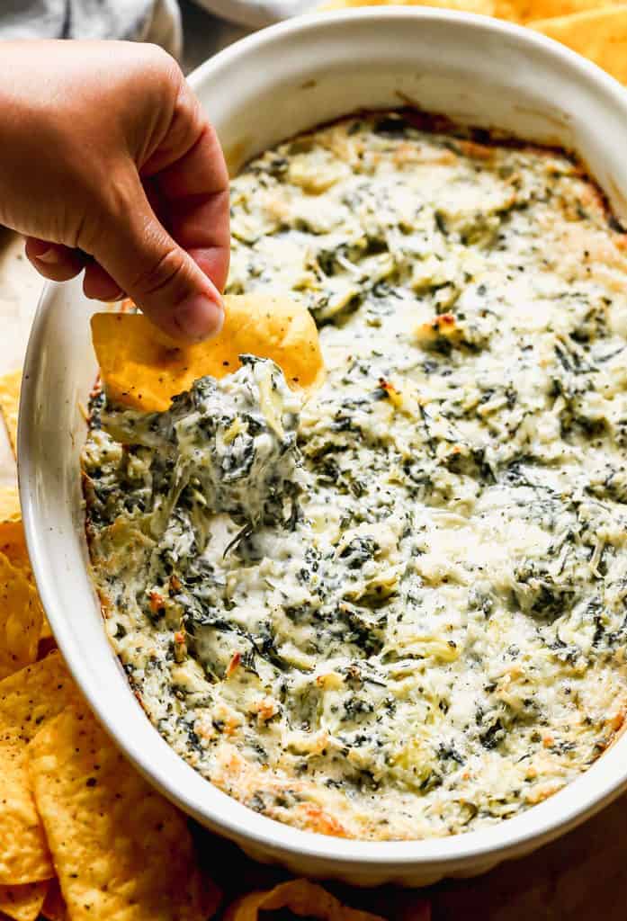 Close up of a spinach artichoke dip bowl