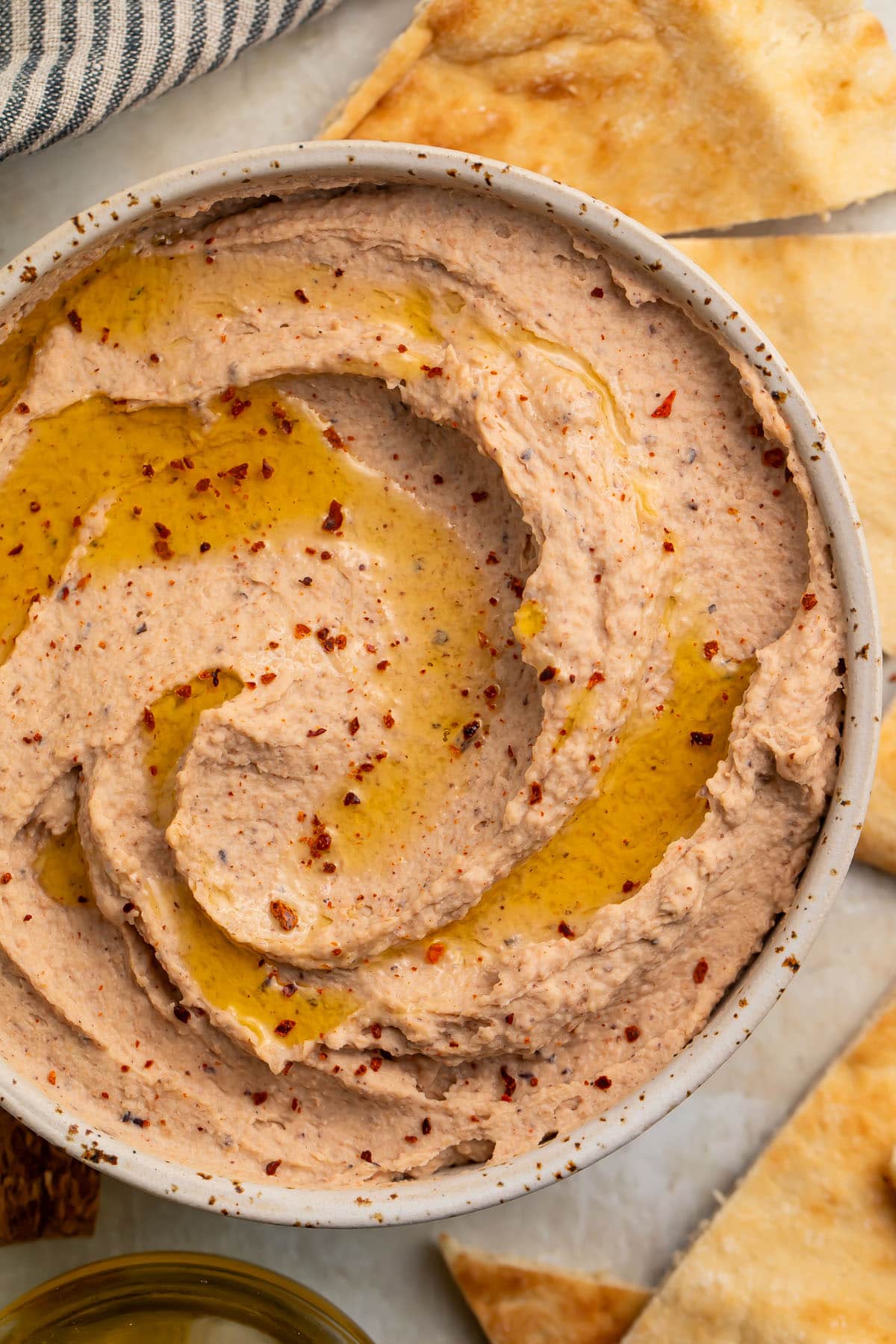 Closeup of a bowl with black eyed pea hummus